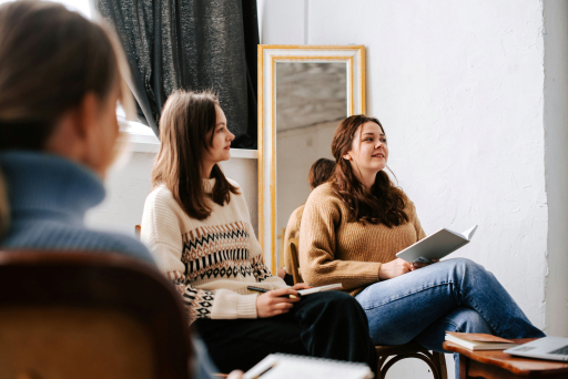 Therapy group session near gold mirror